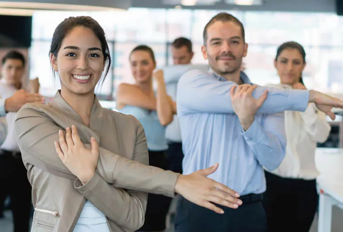 Coworkers stretching together